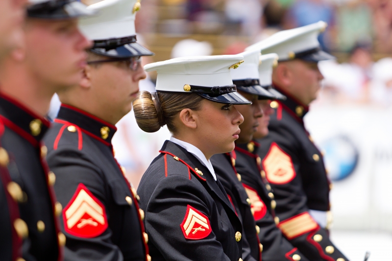 US Military service men and women stand in formation for the national anthem during the Bolder Boulder 10K Memorial Day service.