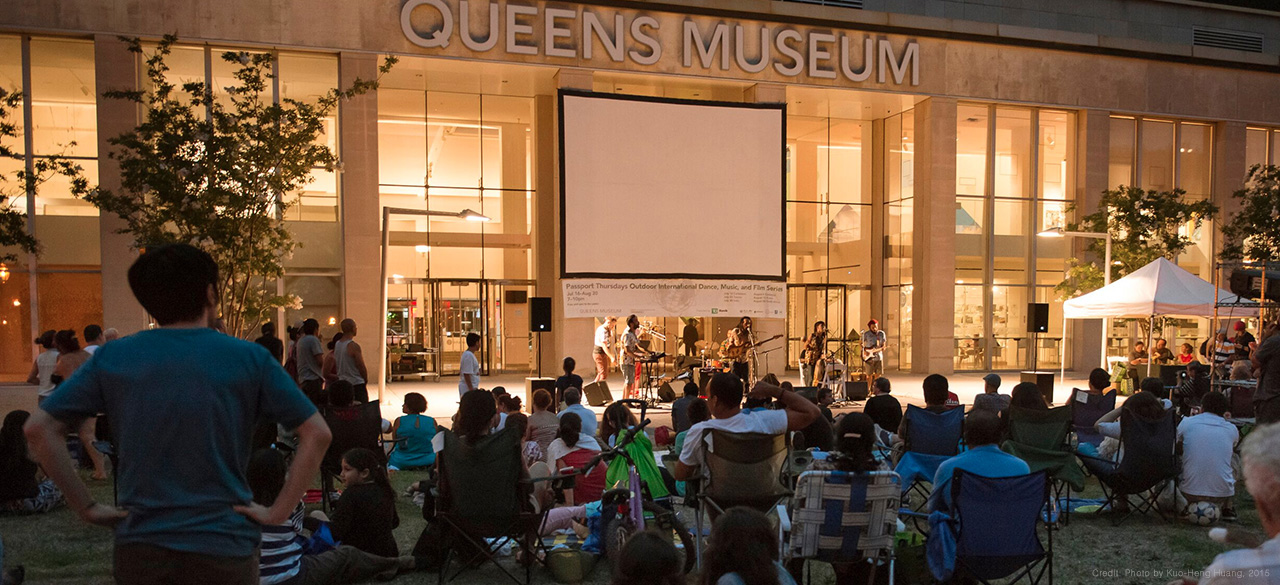 Outdoor evening event at the Queens Museum in NYC