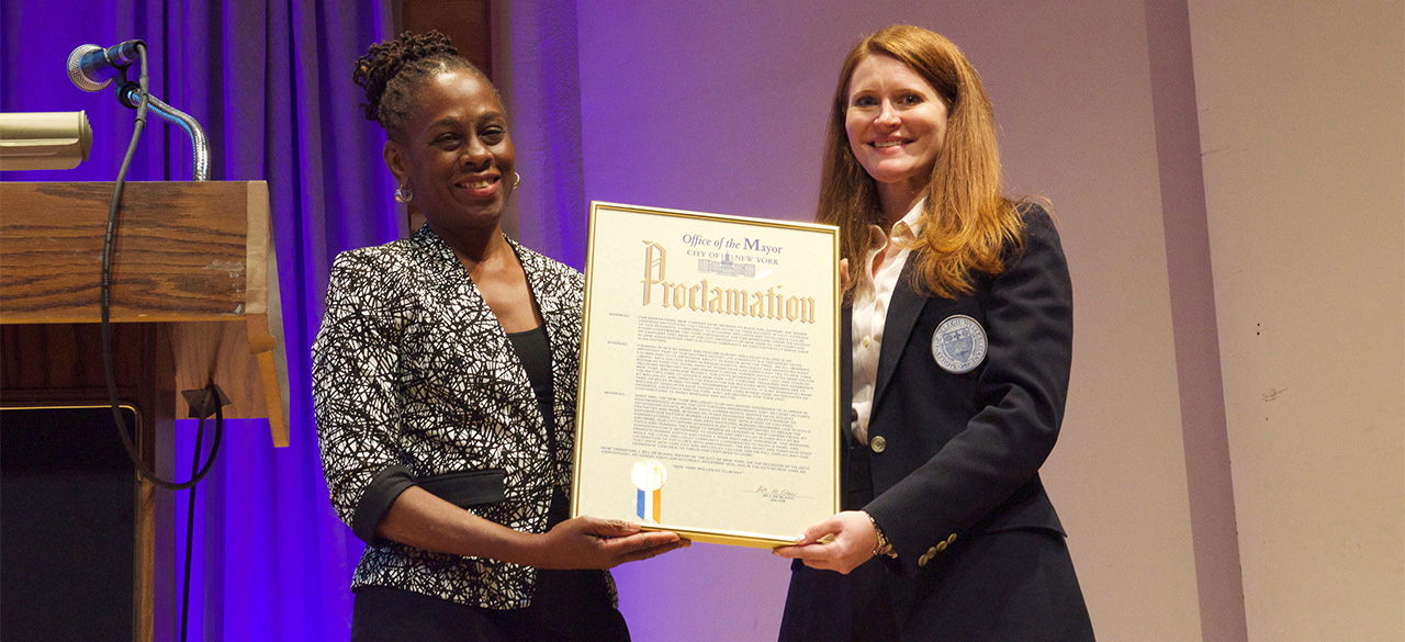 Chirlane McCray '76 presents Brooke Bryant '03 with a proclamation from Mayor Bill de Blasio declaring November 14, 2015 "New York Wellesley Club Day."