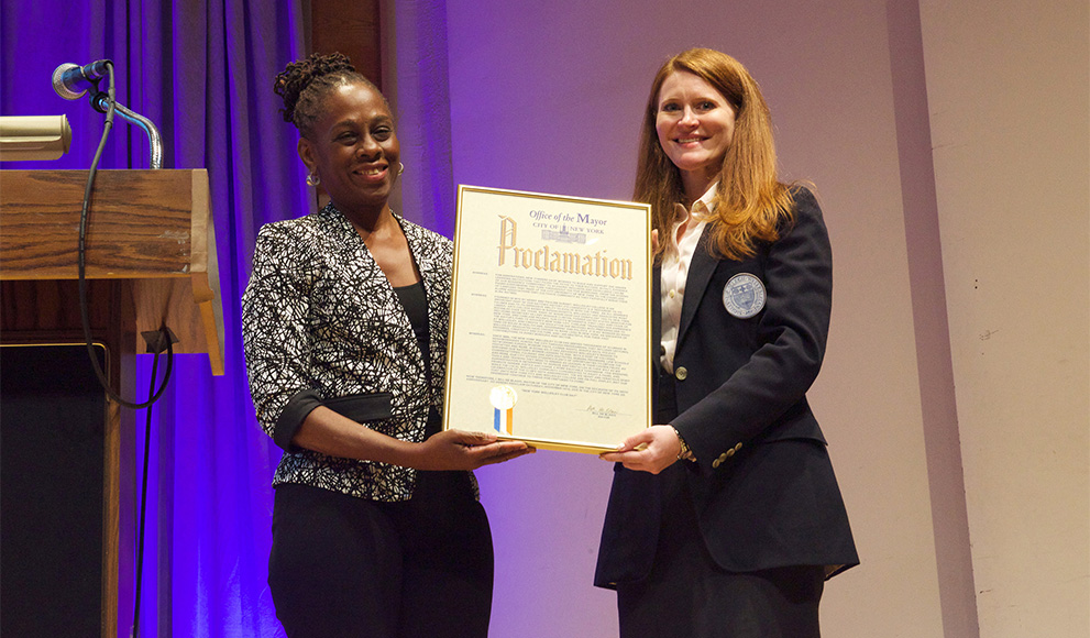 Chirlane McCray '76 presents Brooke Bryant '03 with a proclamation from Mayor Bill de Blasio declaring November 14, 2015 "New York Wellesley Club Day."