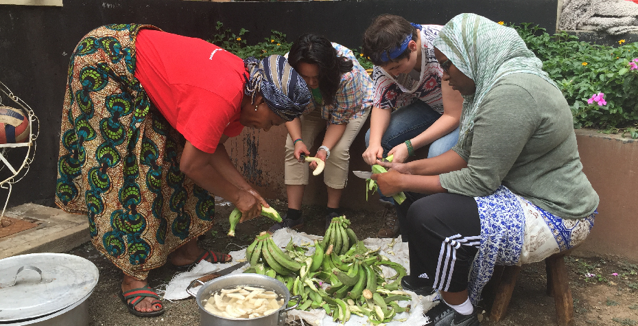 women peeling fruit in Tanzania