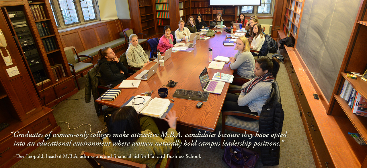 Wellesley students gathered around a classroom conference table. 