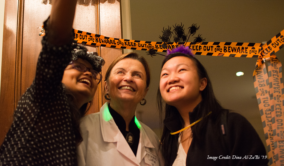 President Bottomly takes a "selfie" with trick or treating students