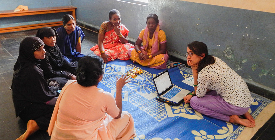 Wellesley College Student Jessica Saifee talks with a group of women in rural India
