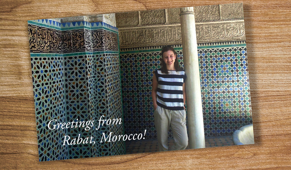 A postcard on a table shows Catherine Puga '17 in Rabat Morocco