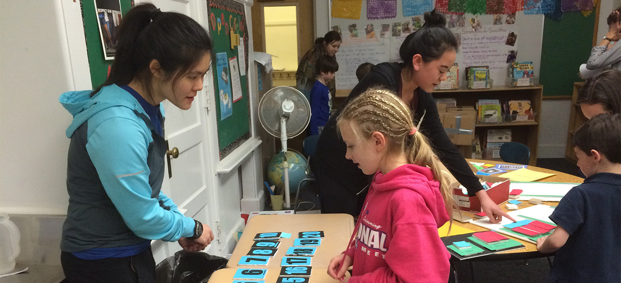 Elizabeth Hau '16, left, and a student at John D. Hardy Elementary School