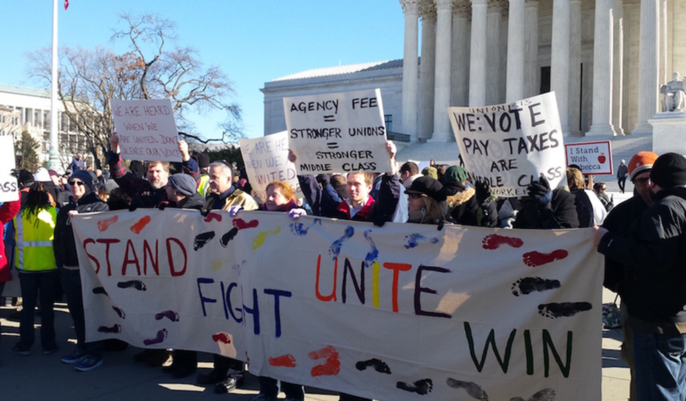 Protesters rally outside the Supreme Court as the court heard arguments in Friedrichs v. California Teachers Association