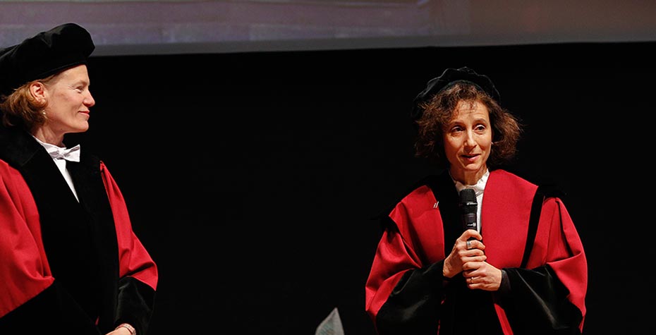 Peggy Levitt at microphone upon receiving honorary degree