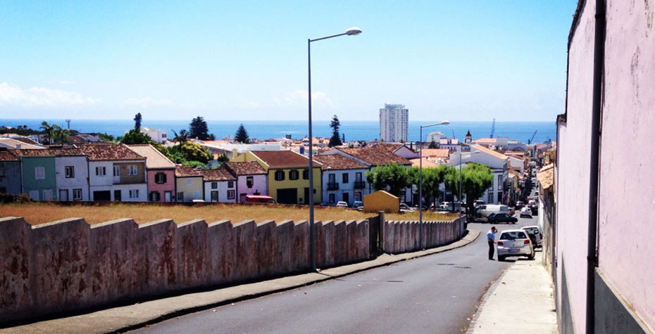 street scene with ocean in distance