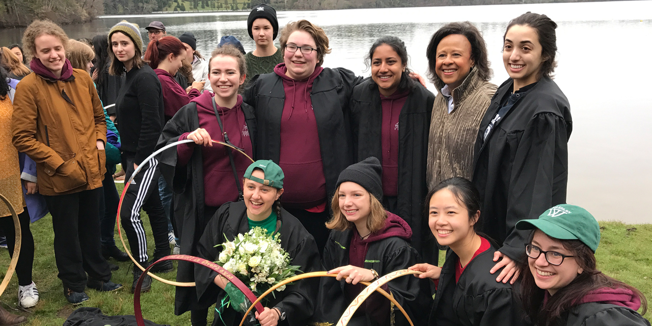 Wills poses with President Paula A. Johnson and friends