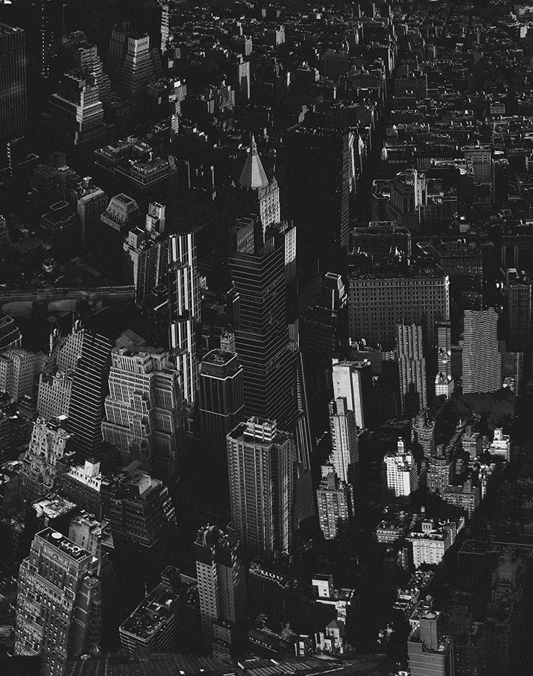 black and white densely layered cityscape viewed from above