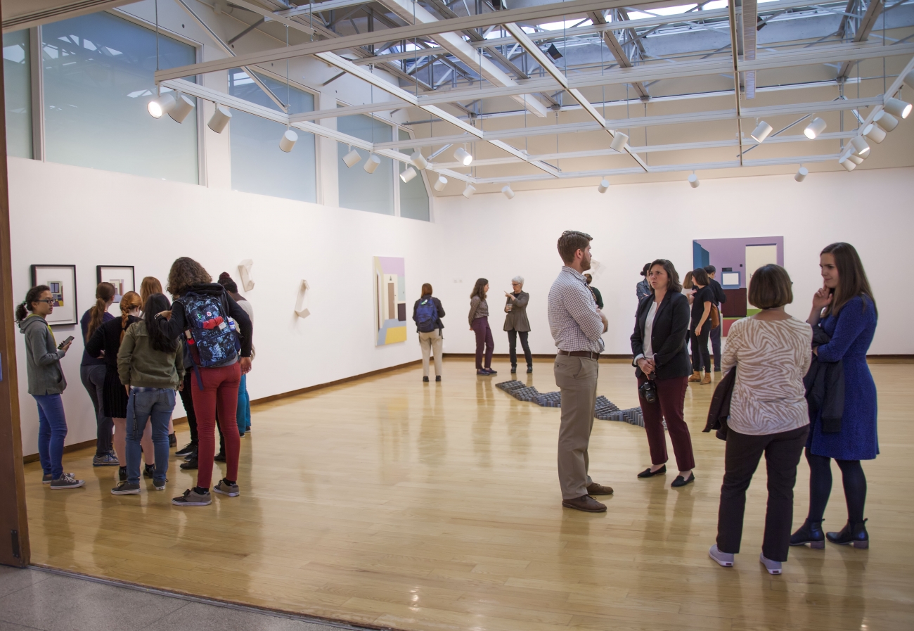 people standing in the Jewett Gallery for exhibition opening reception