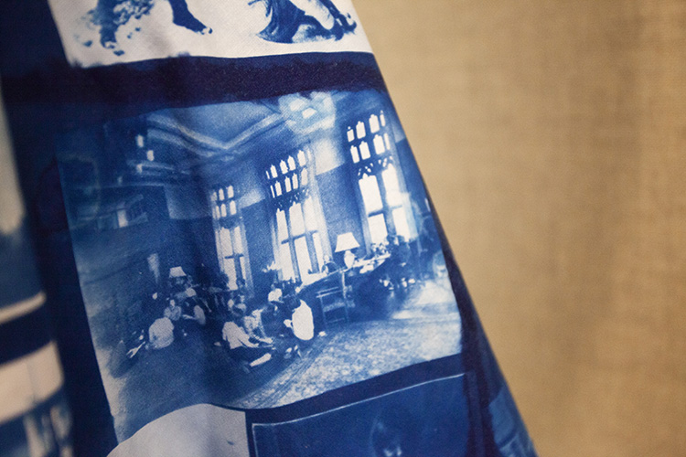 close up of cyanotype printed on fabric showing blue and white image of old fashioned classroom