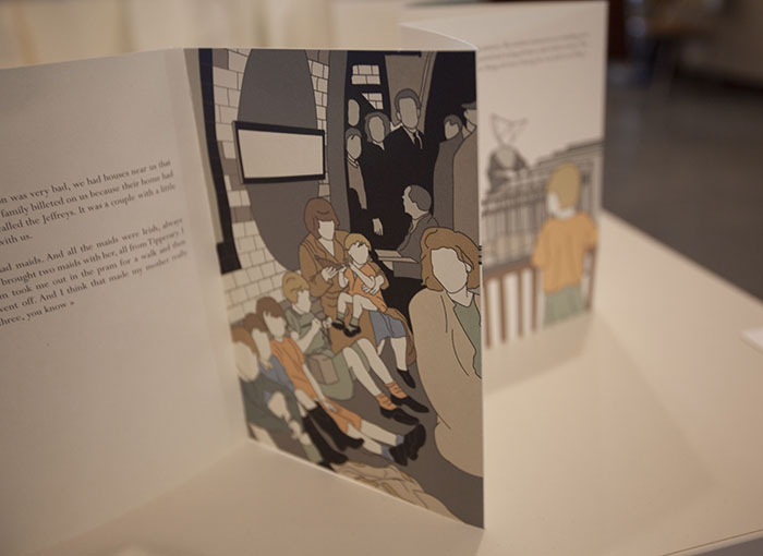 close up on part of an accordion book, showing illustrations of faceless people