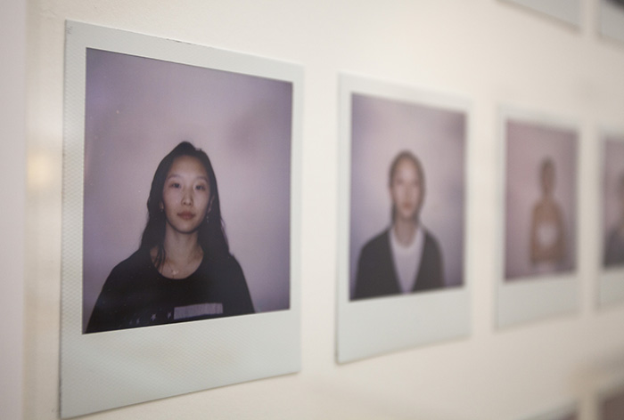 close-up from left of a row of portrait polaroids