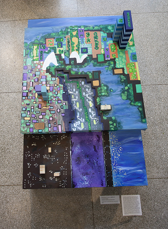 looking down at a colorful multi-level sculptural painting with elements of architectural design