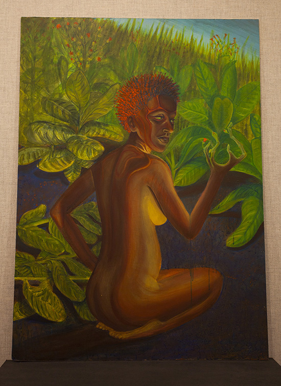 A vertical painting of a kneeling nude figure with brown skin and short red hair. There is lush green foliage behind them, and one upraised hand is turning into plant branches.