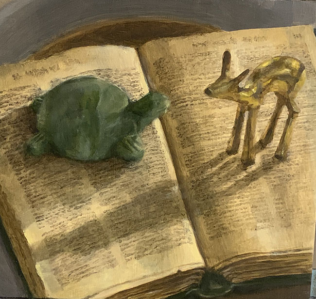 painting of a green plastic turtle at left and a gold metal deer at right, standing on top of an open book