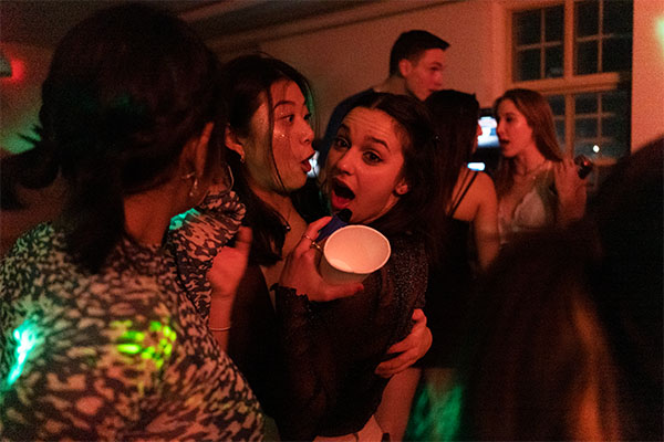 photo of a party scene lit with red light