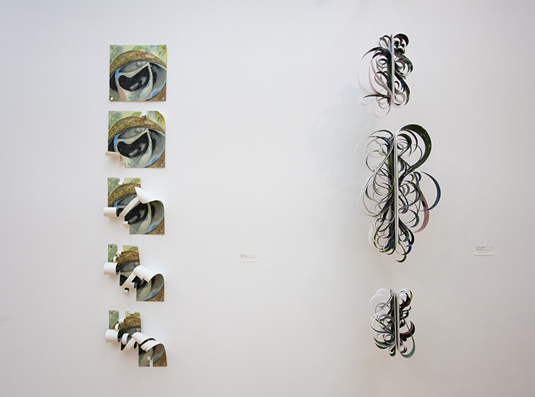 two vertical works; at left a vertical stack of 5 square paintings, increasingly cut and curled from top to bottom; at right, hanging forms bent into curled arabesques 