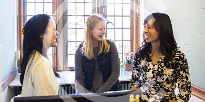 group of students smiling at each other