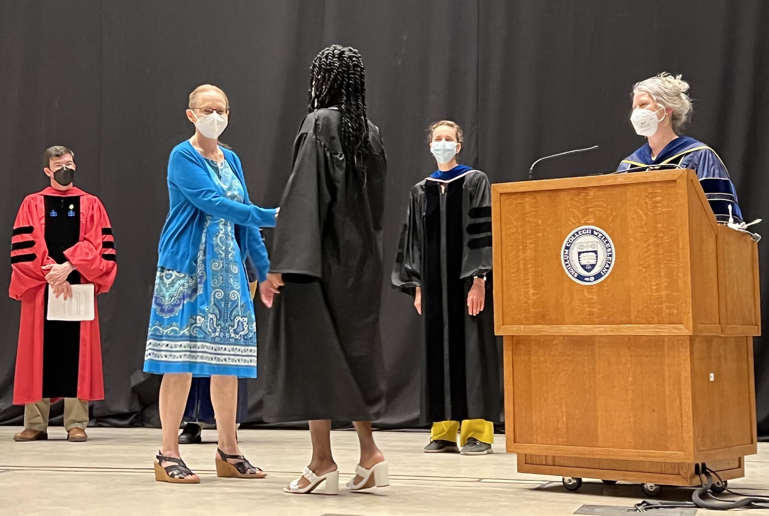 Photo of Corri Taylor congratulating Ann-Marsha Alexis 