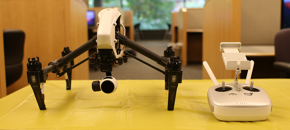 A small drone sitting on a table