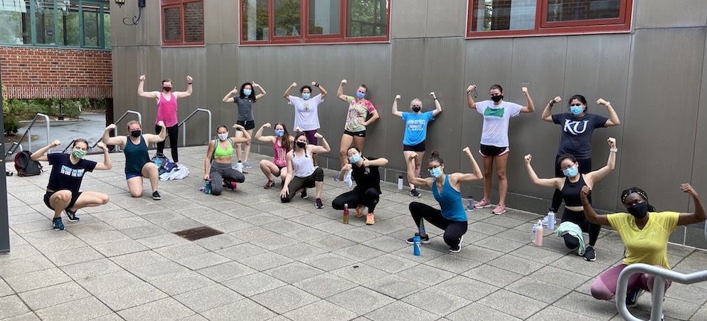 students flexing following a bootcamp fitness class