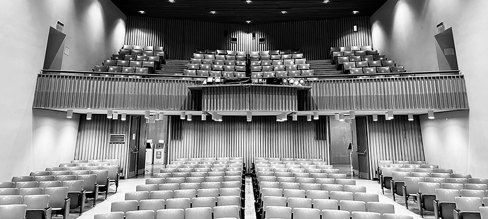 Black and white image of Jewett Auditorium, facing the audience.