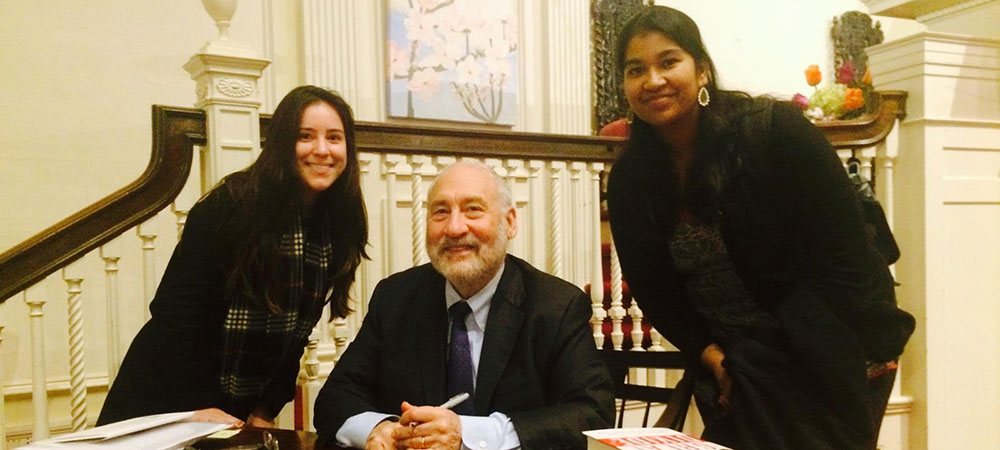 Two students with Joseph Stiglitz