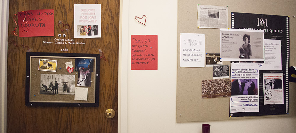 photo of office door and bulletin board with posters and student-made signs