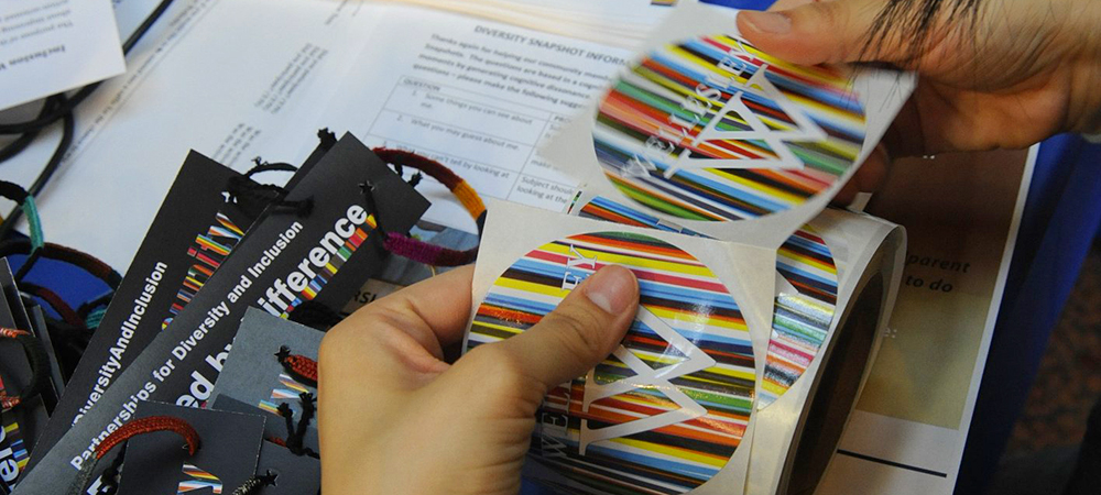 Merchandise stickers for Wellesley's Partnerships for Diversity and Inclusion