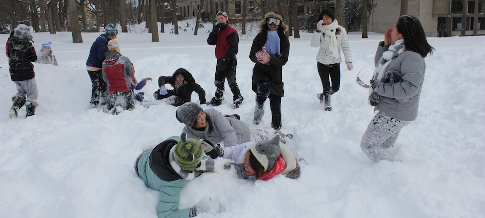 Student participate in a snow fight on Severance Green