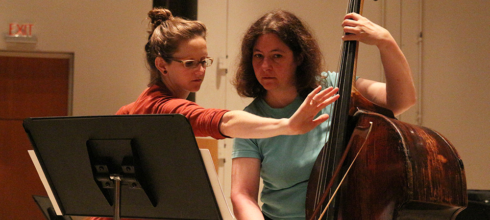 Student and teacher practice the bass