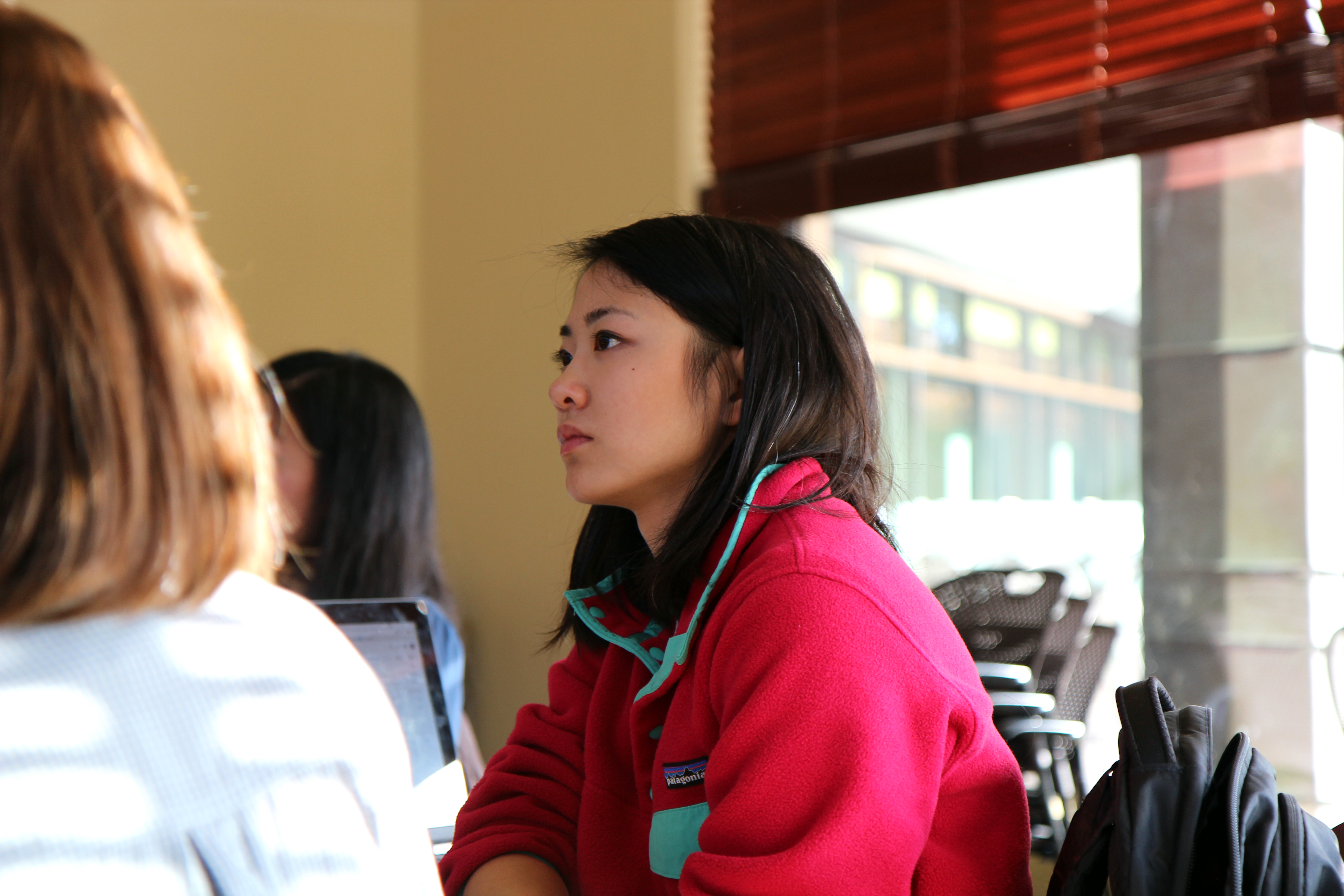 Research Assistant Jamie Yang listens during QAI Lunch Seminar