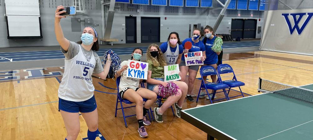 Students cheering for ping pong players