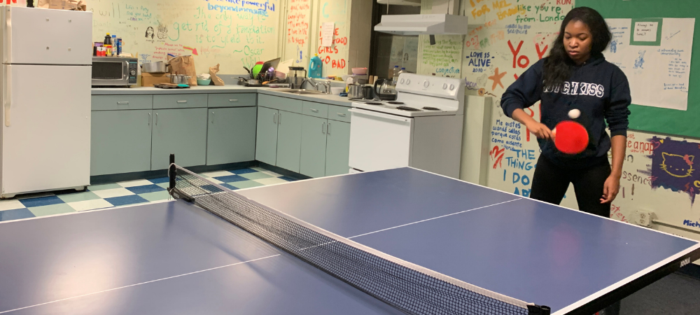 A student playing ping pong