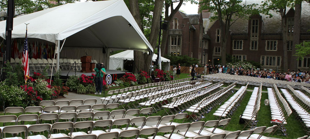 A sea of white chairs and red decorations spread out across the field, ready for the class of 2012