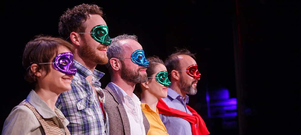 actors onstage wearing masks