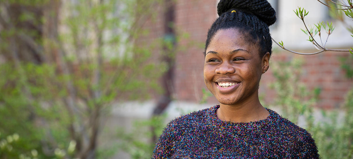 Picture of a happy student outside.