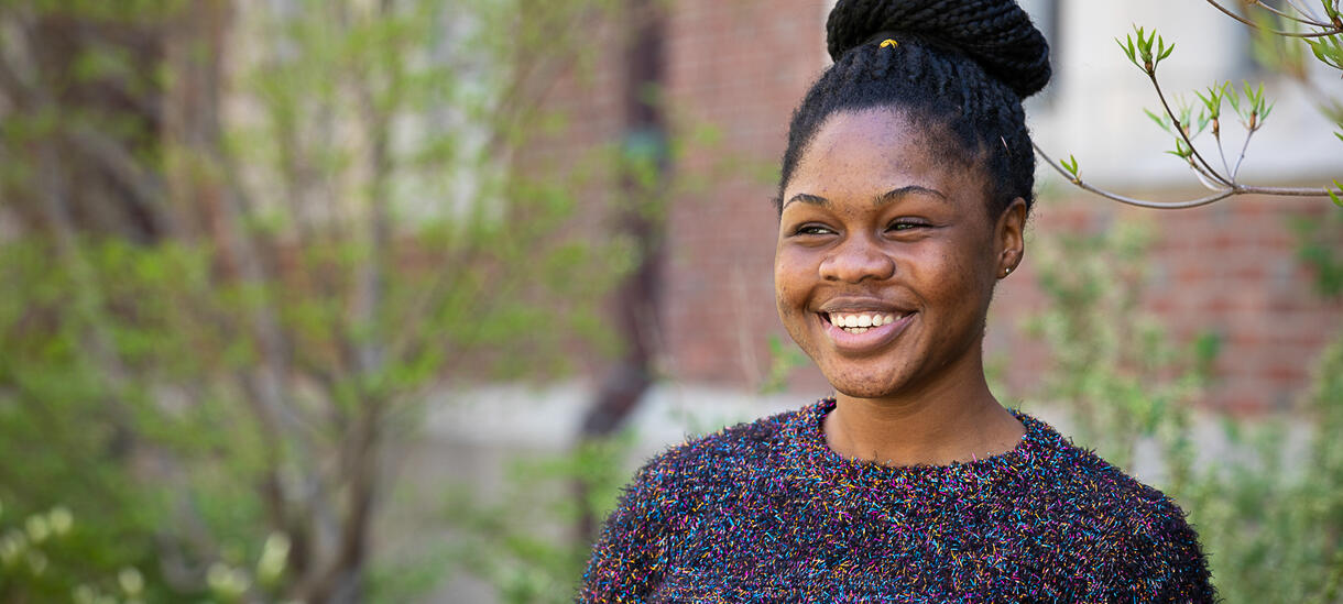 Picture of a happy student outside.
