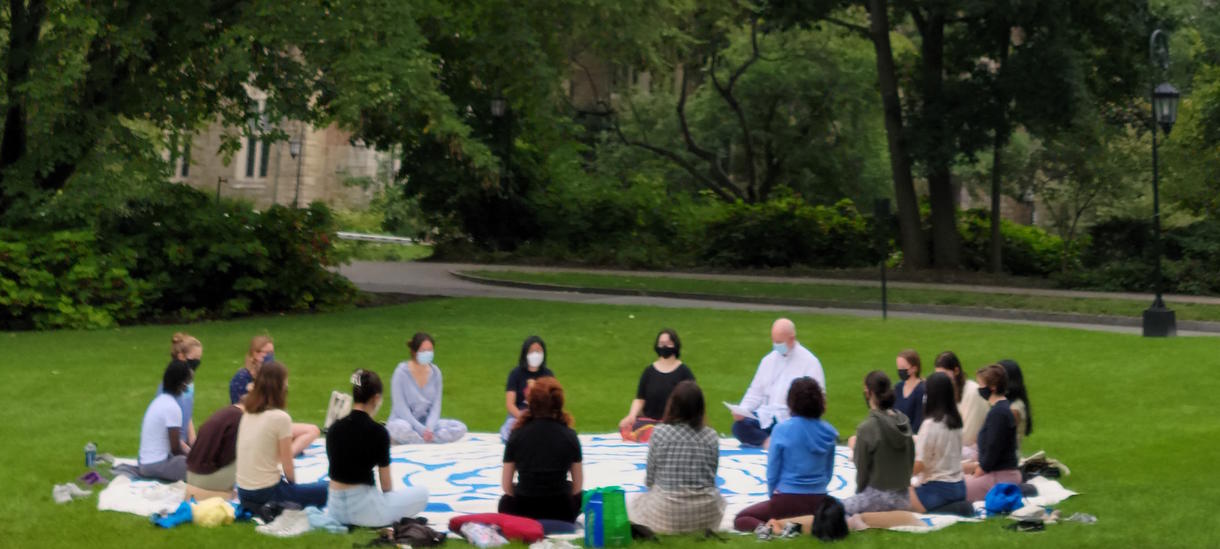 Chaplain John Bailes and students gather on Chapel lawn for meditation. 