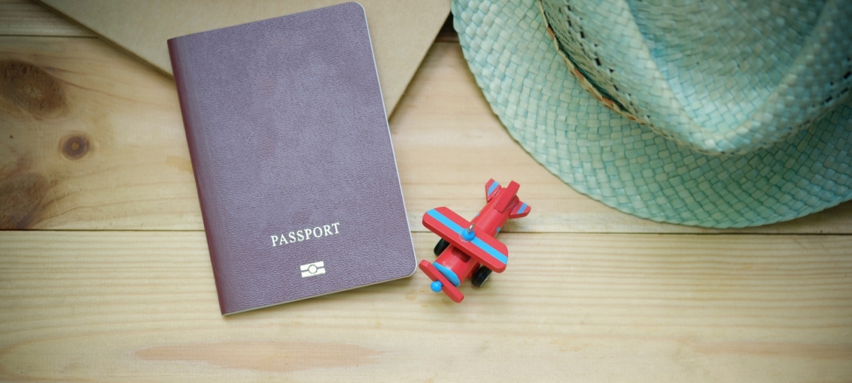 Passport and toy airplane