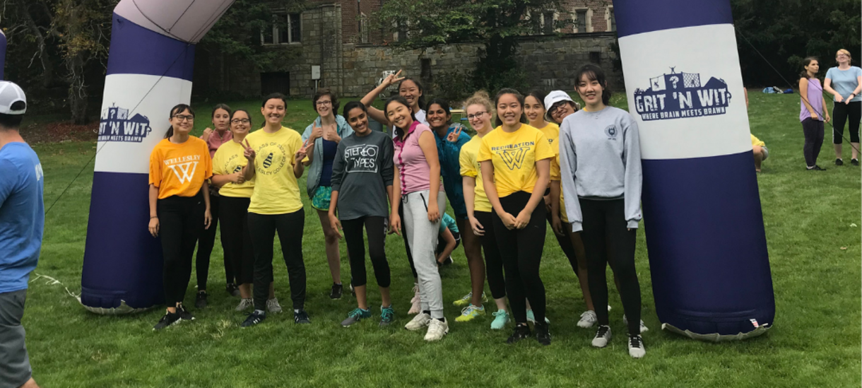 students posing in front of the grit n wit starting line