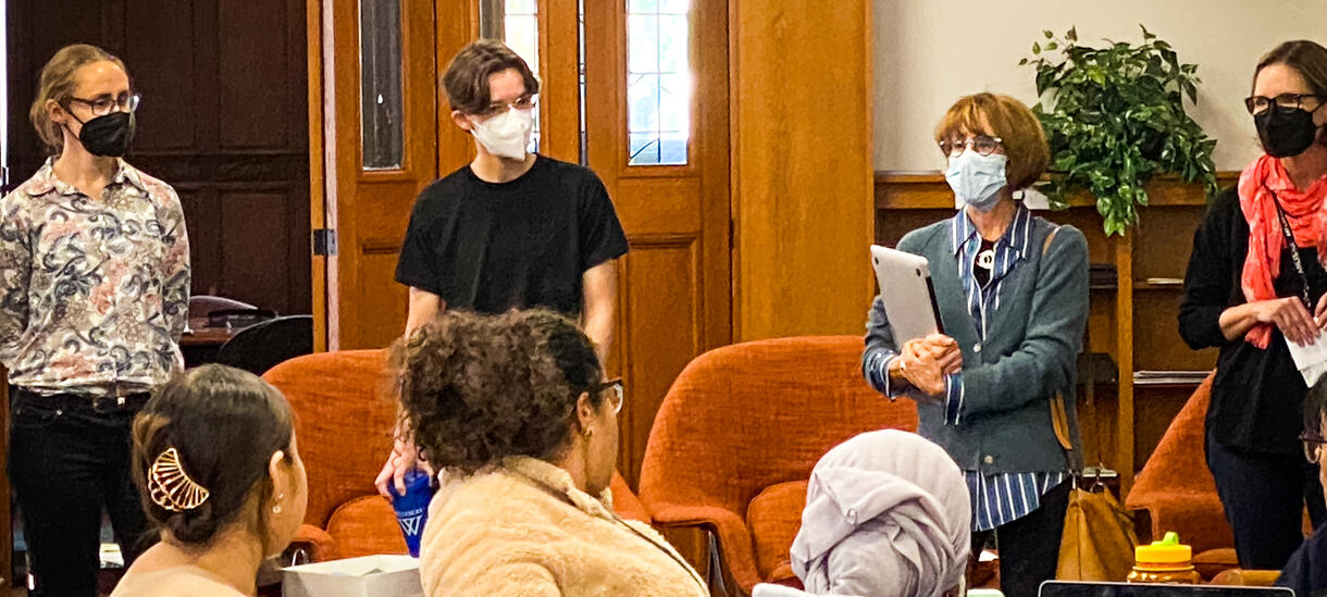 students gathered at tables 