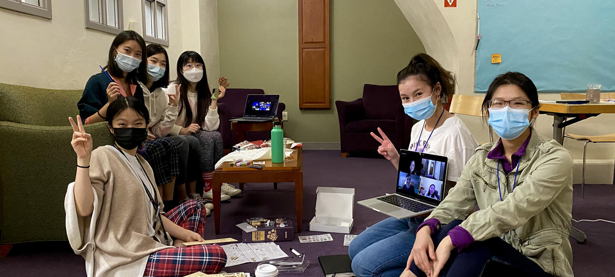 Students in dorm having program with masks on