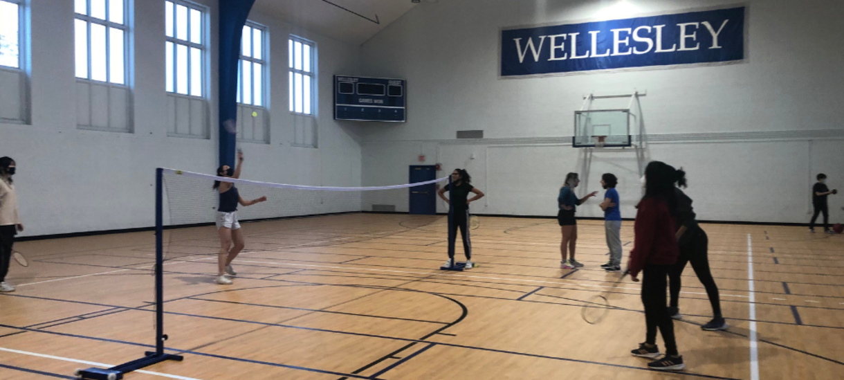 Students playing badminton at Open Rec