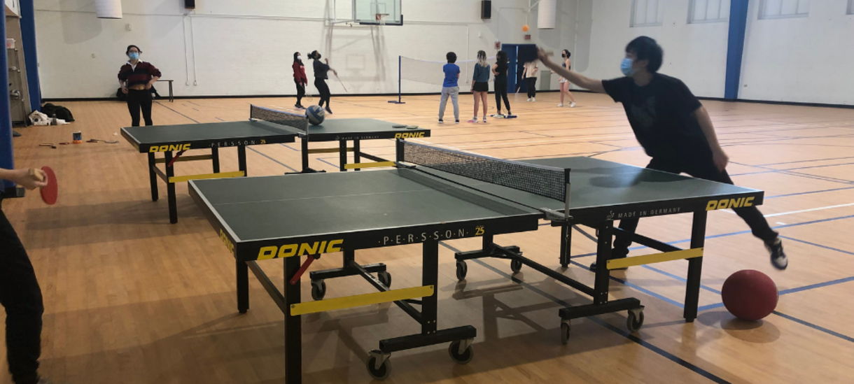 Students playing ping-pong at Open Rec