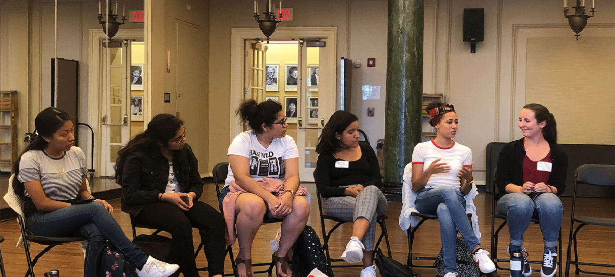 Students sitting together and discussing in Alumnae Ballroom