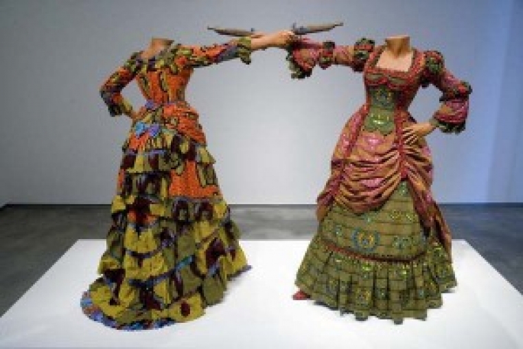 Yinka Shonibare, How to Blow up Two Heads (Ladies), 2006. Two fiberglass mannequins, two prop guns, Dutch wax printed cotton textile, shoes, leather riding boots, plinth. Museum purchase with funds provided by Wellesley College Friends of Art, 2007.124.1-.2